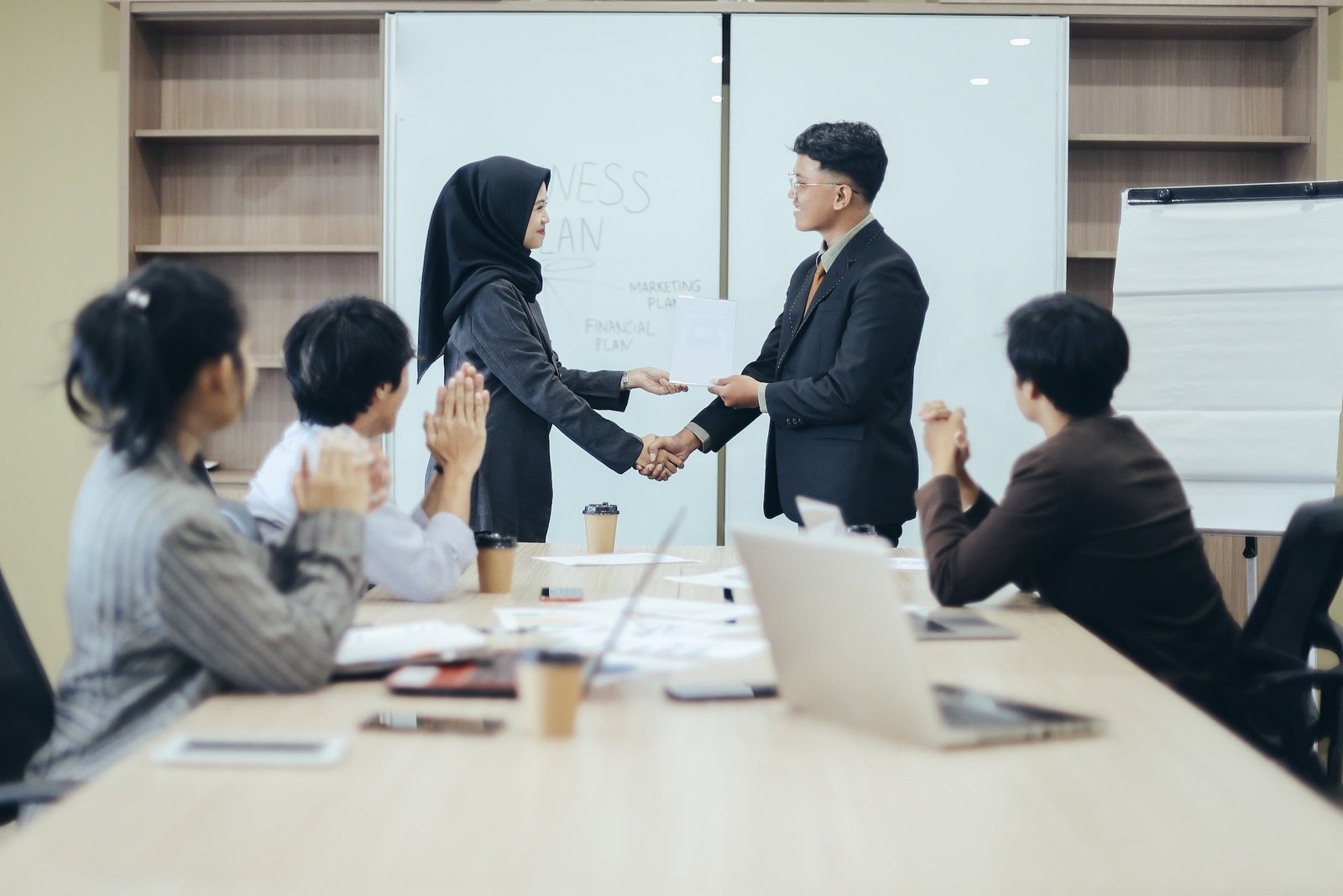 manager-awarding-workers-during-meeting.jpg